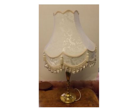 Modern brass columned electric side light on a circular base and teak socle, with matching cream tasselled shade, 31" tall 