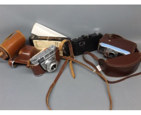 Four assorted cameras: leather cased Kodak camera, boxed Brownie, Kodak portable 620 and case and further G B Bell & Howell c