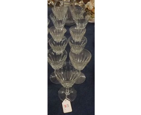 Part set of eighteen pieces of fluted Baccarat glass wares, comprising five champagne glasses, eleven various sized wine glas