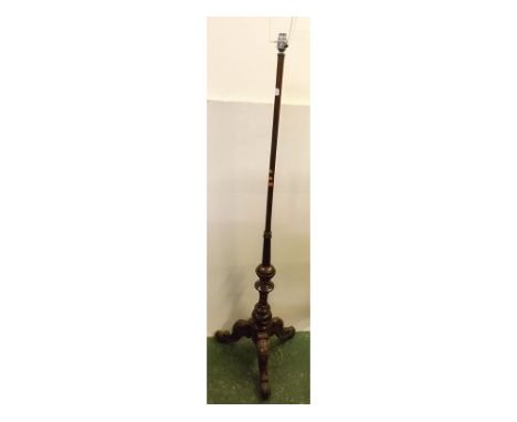 19th century mahogany pole screen converted to a standard lamp on a carved tripod base with cylindrical column measuring 55 i