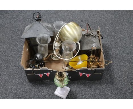 A box of assorted continental light fittings, brass table lamps, antique oil lamp with green glass reservoir on green glass b