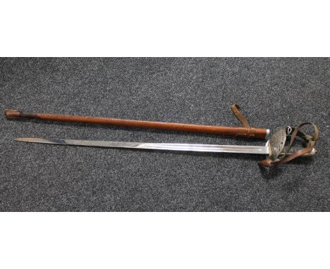 A British 1897 pattern infantry sword in leather scabbard 