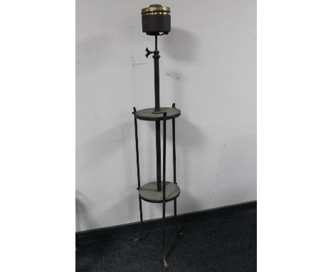 An antique rise and fall wrought iron oil lamp base 