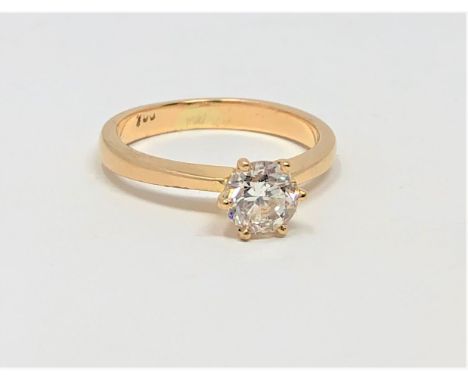 An 18ct gold solitaire diamond ring, the brilliant-cut stone weighing approximately 0.90 carat, claw-set upon knife edge shou