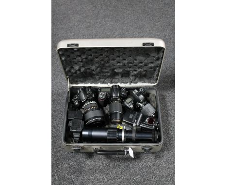 A camera case containing Nikon D300, Nikon D3100, Nikon 120mm macro lens, 450mm lens, Nikon SB-25 flash, Nissin flash, Nikon 