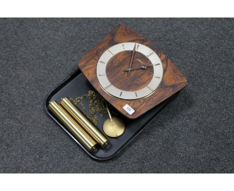 A mid 20th century Jungmans walnut wall clock with pendulum and weights 