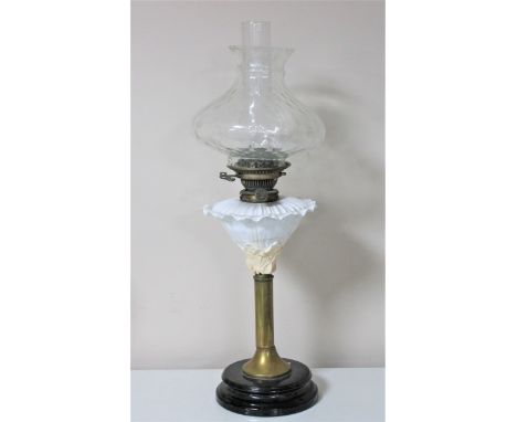 A Victorian Hinks safety oil lamp with glass chimney and shade CONDITION REPORT: Crack near base of chimney. 