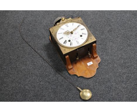 A continental enamelled dial wall clock by mounted on a walnut board, with pendulum and weights 