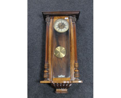 An antique mahogany cased Vienna wall clock, with pendulum, no weights 