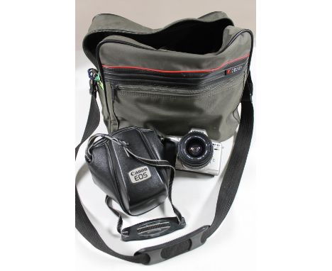 A Delsey bag containing vintage cameras 