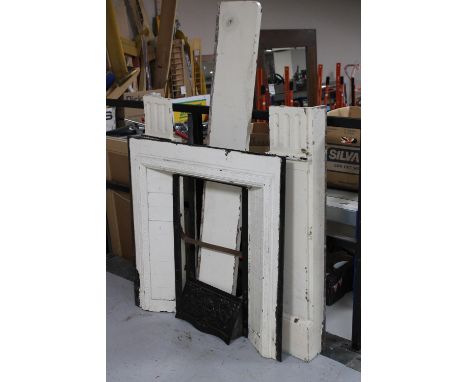 A Victorian cast iron fire place with a painted marble surround 