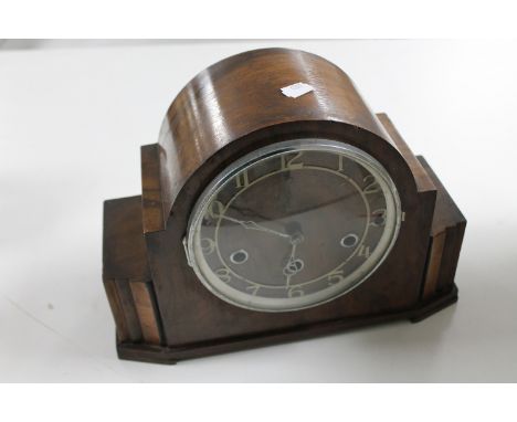 A 1930's walnut cased mantel clock