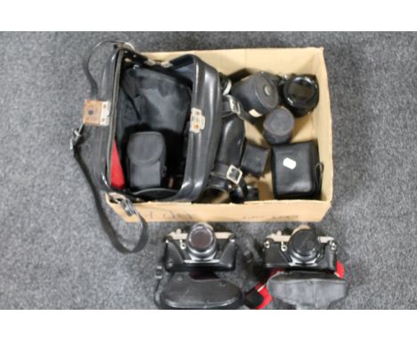 A box containing two Pentax MX cameras, lenses, camera bag 