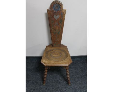 A carved oak spinning chair on bobbin legs 