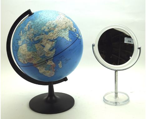 A contemporary magnifying bathroom mirror and a globe on a stand, height circa 40cm