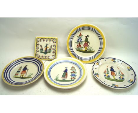 Four French pottery plates and a title, the tile from Desvres and depicting a woman, the plates by Henriot Quimper and decora