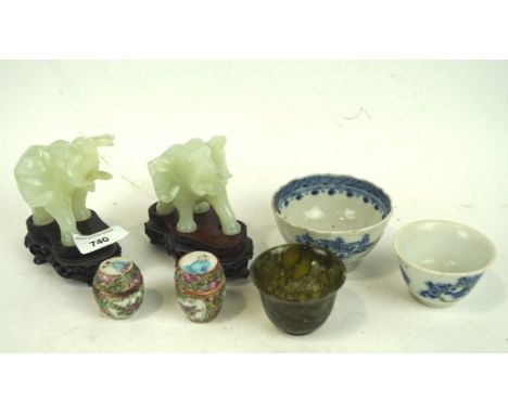 An assortment of oriental wares, to include a Spinach Jade bowl, pair of carved stone figures of Elephants, upon wooden bases