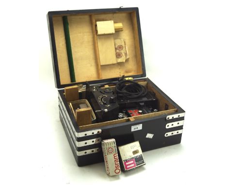 A vintage Pathescope cine film projector, 9.5mm, together with a selection of related accessories, in carry case