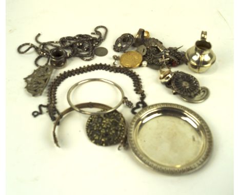 A selection of white metal wares and costume jewellery, including pendant on chain, dish, bangle and more