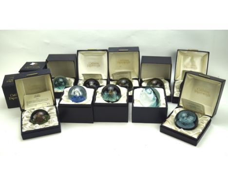 A collection of Caithness paperweights, of assorted styles and designs, the majority in the original boxes