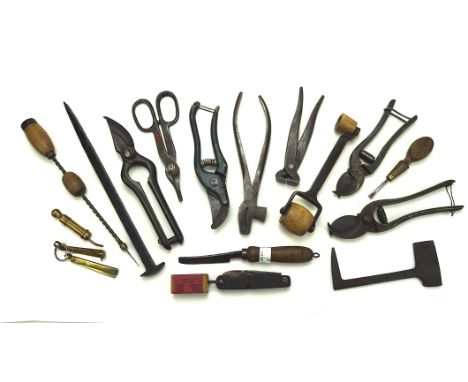 A collection of vintage tools, including pliers, folding knife and more
