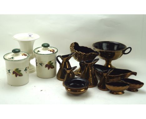 A group of Beswick copper lustre ceramics and other wares, to include a graduated set of pouring jugs, dishes, two Poole pott