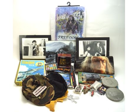 A collection of film and TV related items, including Lord of The Rings posters, a Stingray jigsaw puzzle, baseball caps and m