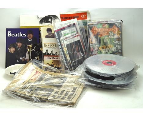 An assortment of music magazines and memorabilia, including 'The Beatles' by Terry Burrows, 'The Beatles, a private view' by 