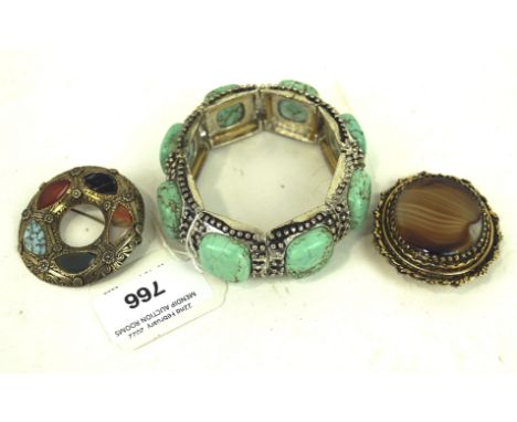 A Mexican Turquoise mounted expanding bangle, mounted on white metal Condition Report: Overall in good condition. Would benef