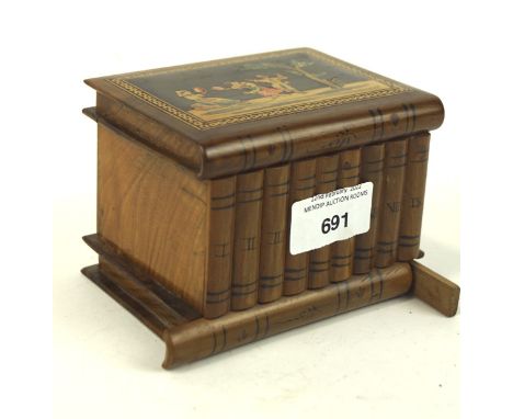 A 20th century continental olive wood puzzle box, in the form of nine books stacked on a shelf, 8.5cm high Condition Report: 