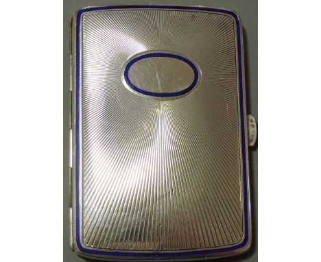 An early 20th century continental 900 standard silver and blue enamel cigarette case. The engine turned body with embossed st