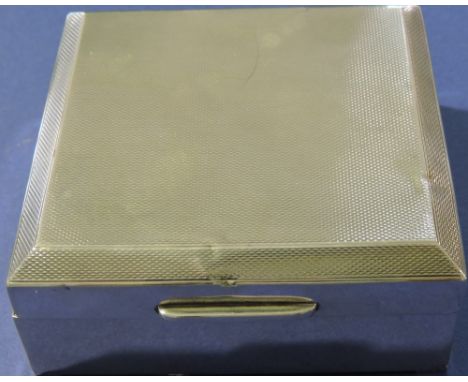 A square silver box, Birmingham 1959, decorated with engine-turning, with ceder lining, W. 9cm.