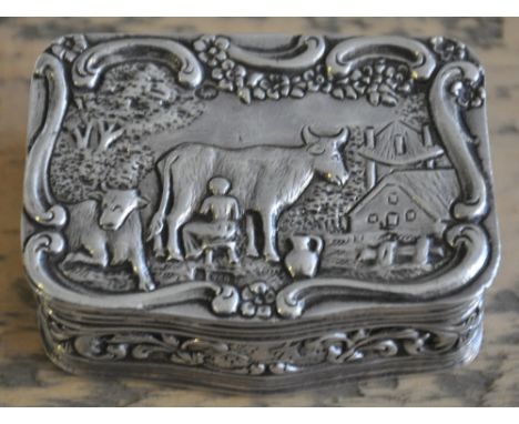 A late 19th century rectangular snuff box, the repousse decoration depicting a milkmaid, with a gilt lining, 2ozt.