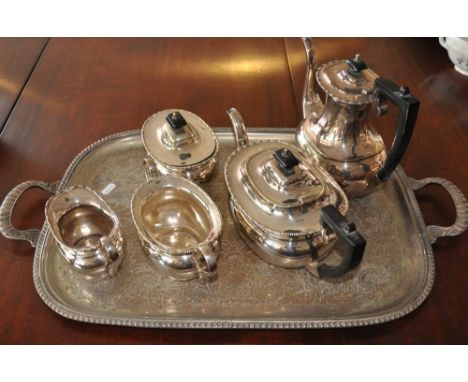 A silver plated tray, together with a four piece silver plated tea service and a paella pan, (qty). 
