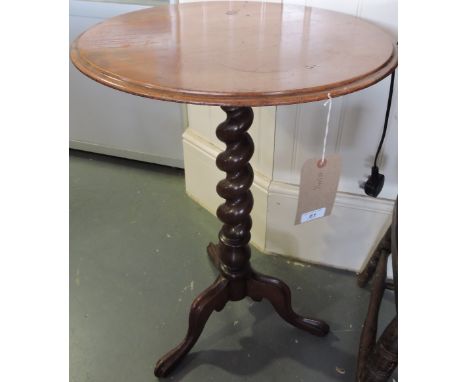 A Victorian walnut occasional table, moulded top above a barleytwist support and tripod base, D. 48cm.