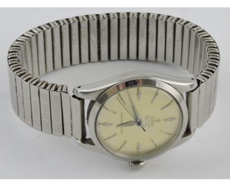 A Tudor Oyster Royal gentlemen's steel cased wristwatch, with dagger hands and baton numerals on a silvered dial, on an assoc