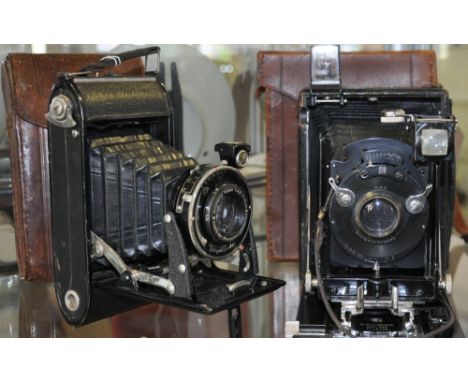 An early 20th century Voightlander Bessa F11 Bellows camera, tan leather cased together with a cased Ernemann plate camera of
