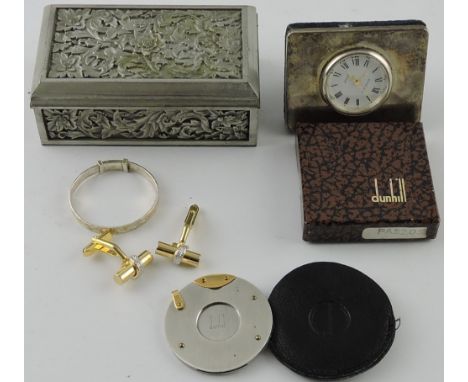 A Dunhill cigar cutter, in leather pouch and retail box; together with an easel table timepiece set in silver, a pewter recta