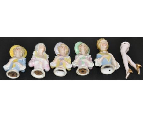 5 early 20th Century glazed porcelain pin cushion ladies, largest 8 cms. 