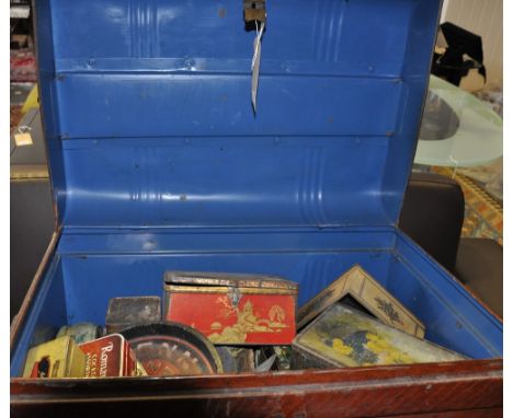 A Victorian simulated oak tin trunk containing a large quantity of 20th Century confectionery and advertising tins. 