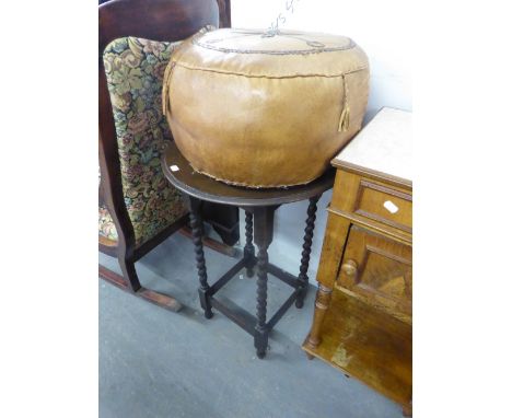 A CIRCUALR TOP OCCASIONAL TABLE RAISED ON BARLEY TWIST LEGS AND A LEATHER CIRCULAR POUFFE (2) 