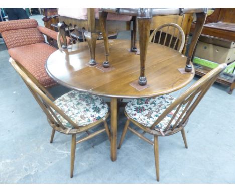 AN ERCOL OVAL DROP LEAF  DINING TABLE, TOGETHER WITH A SET OF FOUR ERCOL STICK BACK CHAIRS (5) 