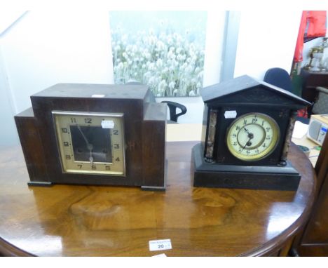 A VICTORIAN MANTEL CLOCK IN BLACK SLATE ARCHITECTURAL CASE AND AN OAK CASED MANTEL CLOCK (2) 