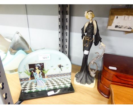 A DECORATED GLASS AND SHAPED MANTEL CLOCK, BATTERY OPERATED AND A 1930's STYLE FIGURAL ORNAMENT 