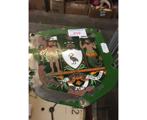 AN ENAMEL BADGE. C