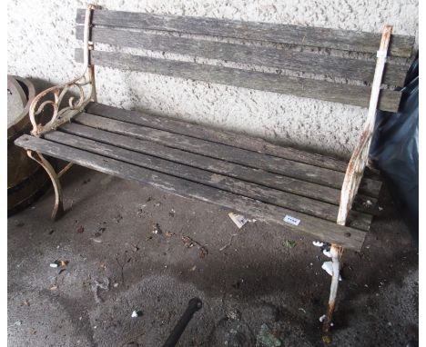 A garden bench with cast iron ends Condition Report: Available upon request