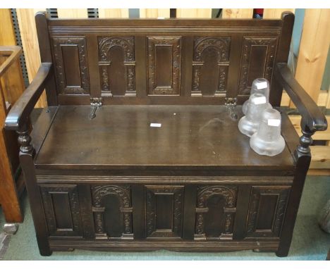 A carved oak hall bench Condition Report: Available upon request