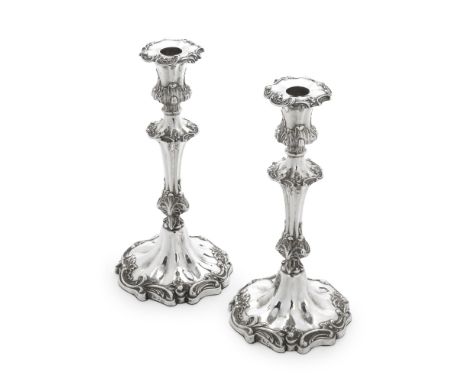 A Victorian pair of silver candlesticksHenry Wilkinson &amp; Co, Sheffield 1848 Fluted knopped baluster form columns embellis