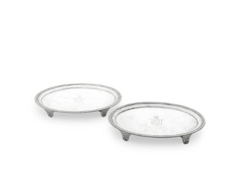 A pair of George III silver salversThomas Hannam &amp; John Crouch II, London 1801 Oval form with a gadroon rim and fluted ba