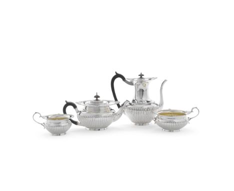 An Edwardian silver four-piece tea and coffee serviceWalker &amp; Hall, the pots Chester 1907, the sugar and cream, Sheffield